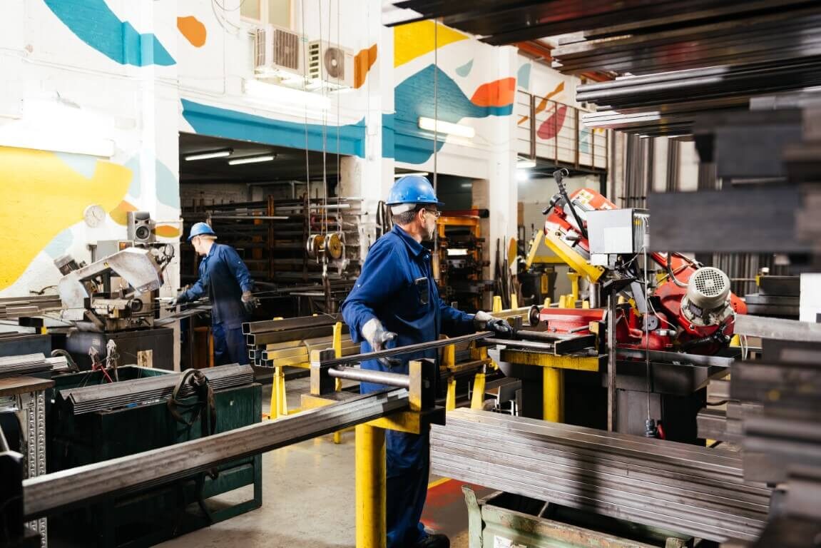 anonymous-male-factory-workers-working-in-industri-2024-01-23-16-14-20-utc